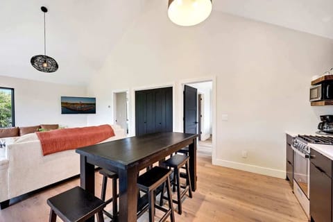 Immerse yourself in the modern furnishings, fast WiFi, and a well-equipped kitchenette, creating a home-away-from-home ambiance. Indulge in the pleasure of savoring a delicious home-cooked meal, or effortlessly transform the space into a functional work area where you can set up shop and focus on your tasks.