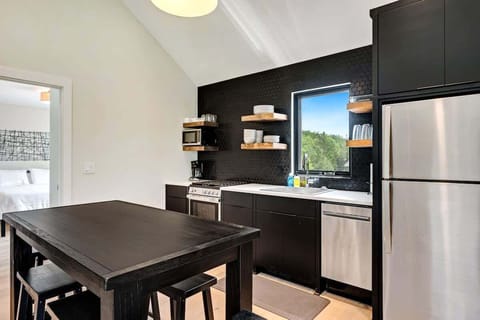 Immerse yourself in the modern furnishings, fast WiFi, and a well-equipped kitchenette, creating a home-away-from-home ambiance. Indulge in the pleasure of savoring a delicious home-cooked meal, or effortlessly transform the space into a functional work area where you can set up shop and focus on your tasks.