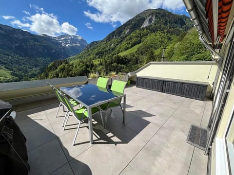 Large sun terrace with panoramic views of the Tamina Valley and the Calanda mountain.