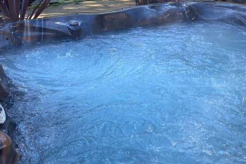 PRIVATE Hot Tub surrounded by beautiful gardens and privacy fence.