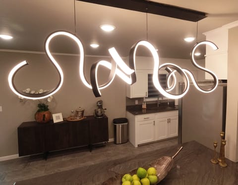 Enjoy a quick snack at the bar while being able to visit with those in the kitchen or living room.  Kitchen & Bar Area