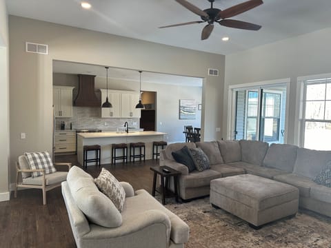 Kitchen has a great view of the fireplace, living room and TV