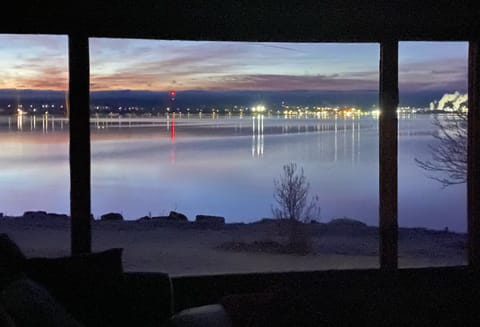 Night view of lake and L’Anse across the bay
