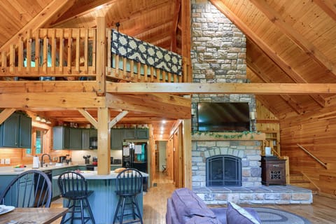 Stunning Cabin Interior. The living room boasts a stunning Electric Fireplace