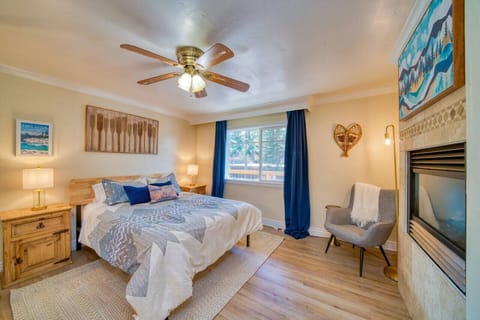 Master bedroom equipped with queen size bed and gas fire place, along with the attached master bathroom.