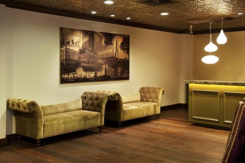 Relax on tufted seating while you plan the night ahead.