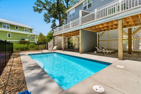 Dive into your shared sparkling pool and sunny deck, perfect for morning laps or afternoon lounging in complete privacy.