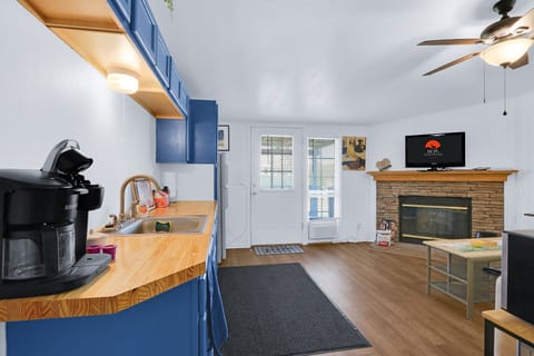 The living room is adjacent to the kitchenette