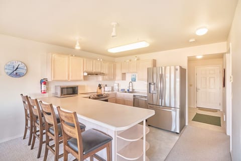 Have the kids sit at the counter and help make breakfast for some fun family memories