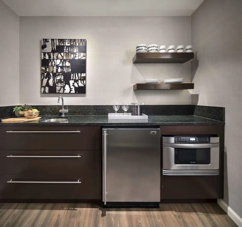 Prepare easy breakfasts on sleek counters with in-room kitchenette.