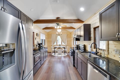 Stainless steel appliances bring clean, modern vibes to this rustic kitchen
