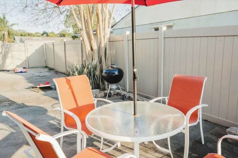 {OUTDOOR PATIO} Enjoy a BBQ with friends and family on the charcoal grill. Eat outside and enjoy the birds chirping and watching the sunset over the water.