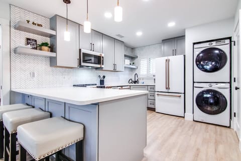 Spacious kitchen with washer and dryer