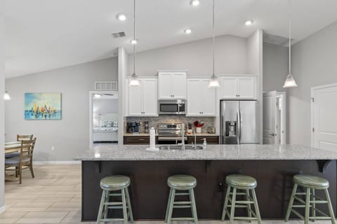 Well-Appointed Kitchen with Ample Storage, Quality Appliances, and Cozy Breakfast Nook.