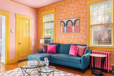 This living room doesn’t whisper—it roars in color.