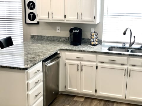 Kitchen with kuerig and complimentary pods, creamers and sweeteners