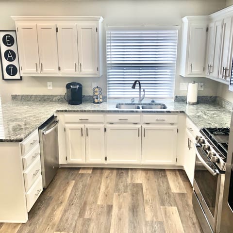 Large kitchen with stainless steel appliances