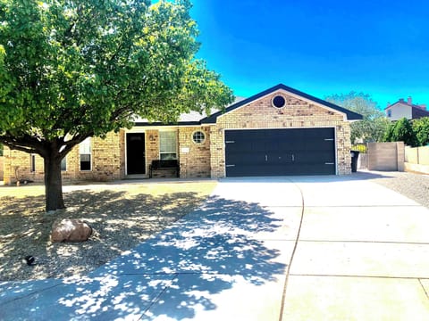 Front of house with 2 car garage and driveway parking