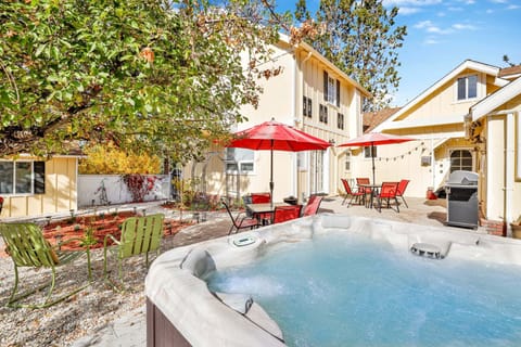 Private outdoor hot tub, surrounded by tall pines, perfect for relaxing under the trees after a day of adventure—enjoy peaceful forest views, fresh air, and a truly rejuvenating stay.