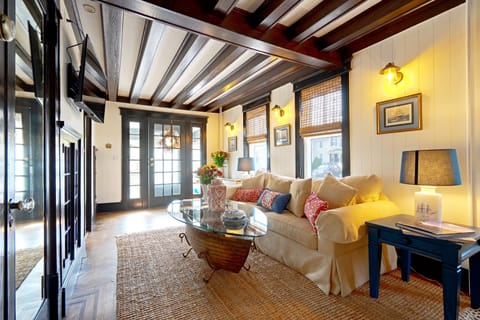 Large Living Room with A Pull Out Full Sofa and Seating Area Near the Fireplace