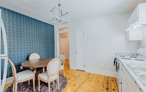 Kitchen and Dining Area with plenty of space to eat and their is a coffee bar to left.