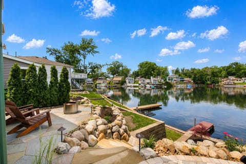 Scenic backyard w/ water views & lounge seating to unwind outdoors