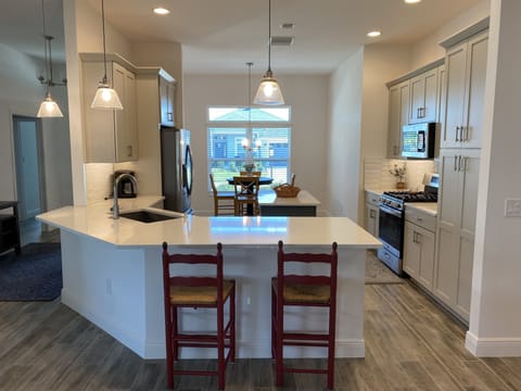 Eat in kitchen, nook, large dining room, table, and two barstool