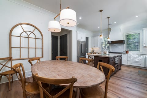 The large oval dining table comfortably seats 8-10