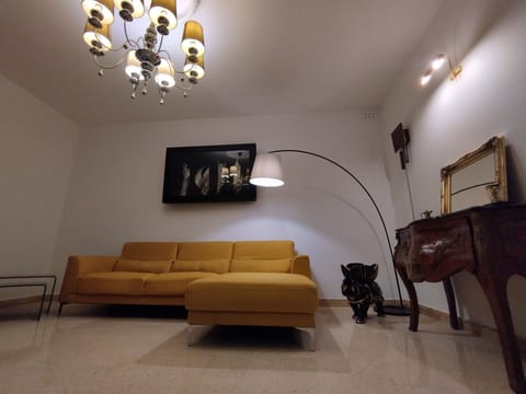 Sofa -living area., having a balcony overlooking the main street