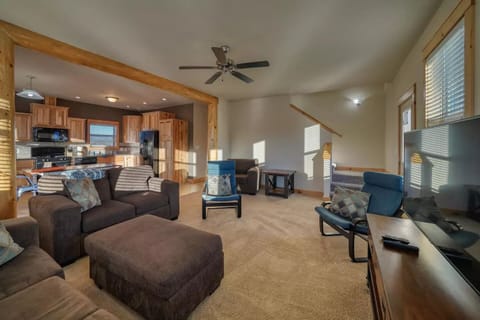 Open living room, dining, and kitchen provides space for gathering.