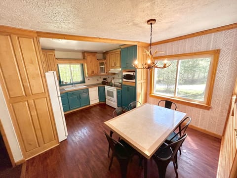 The main dining table comfortably seats 6. More seating can be found at the table in the lounge.