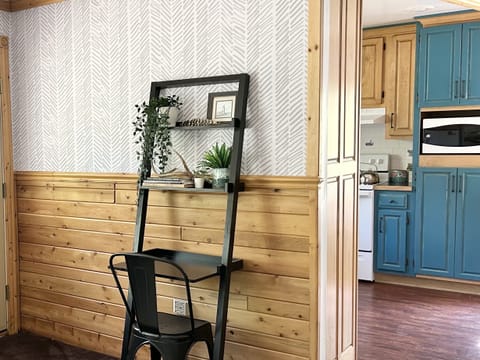 Small desk for working remotely or charging devices.