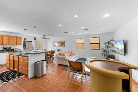 Open-concept living area for group gatherings attached with kitchen