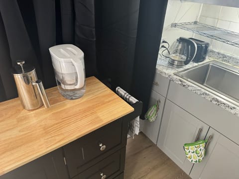 Electric Kettle, Brita Water Filter, Paper Towels, French Press on Table