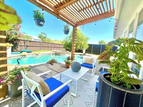 Experience the ultimate retreat with a unique pool and inviting patio furniture, perfect for creating unforgettable family moments and making lasting memories.