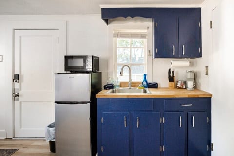 This is our lovely kitchenette, complete with fridge, microwave, and cooktop