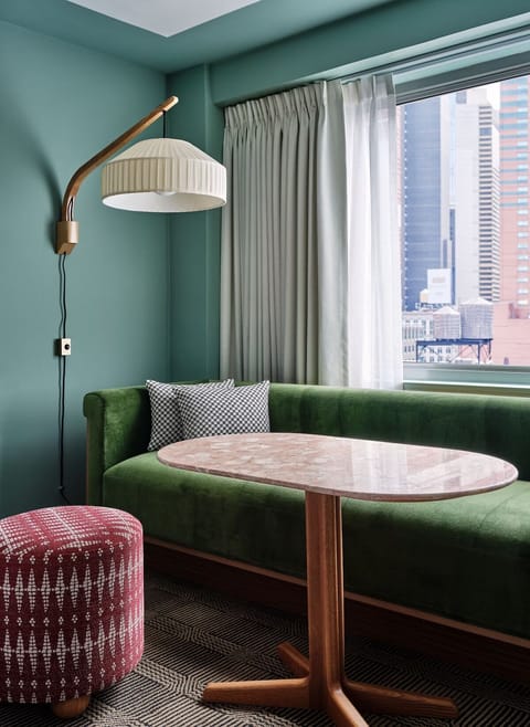 Sip coffee by the window on the plush velvet banquette.