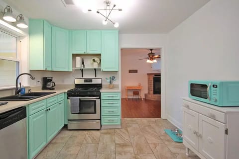 Appliances include a full size refrigerator, gas stove, microwave and coffee pot