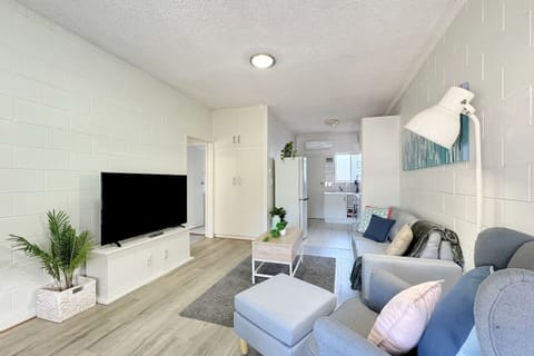 Step into comfort in this airy living space, featuring plush seating, climate control for year-round comfort, and a large window bathing the room in natural light.
