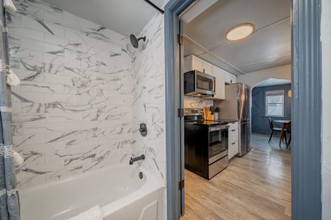 Beautiful tiled shower in fully remodeled bathroom