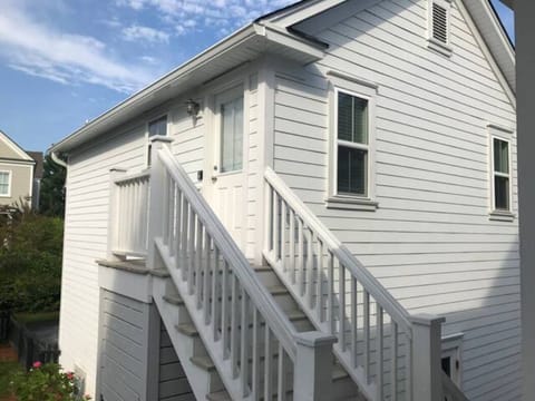 Exterior with steps up to the apartment.