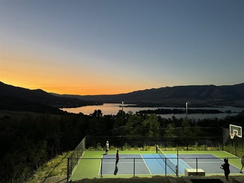 Private Pickleball and basketball sport court overlooking Pineview, well lit and private. May close during winter conditions to avoid damage to the court