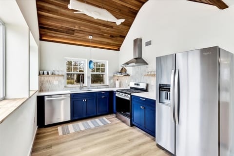 Lots of light in kitchen, gas cook top and dishwasher.  