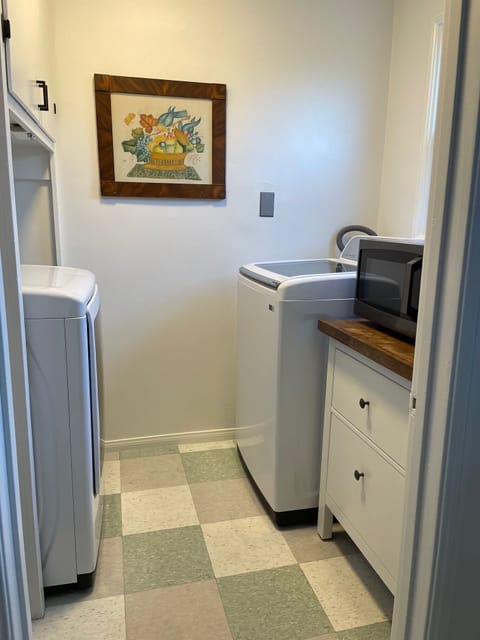Washer and dryer in laundry room right off the kitchen.