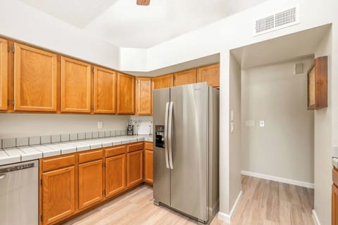 A full-size refrigerator and ample cabinet space grace our kitchen, ensuring your storage needs are met with both style and practicality.