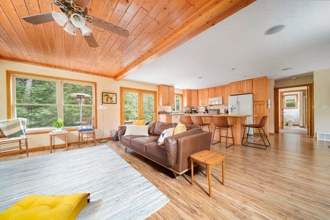 Large windows and glass french doors to the patio show off the river views!