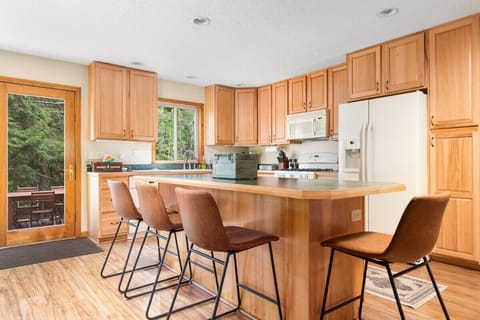 Open kitchen and island seating for the kids!