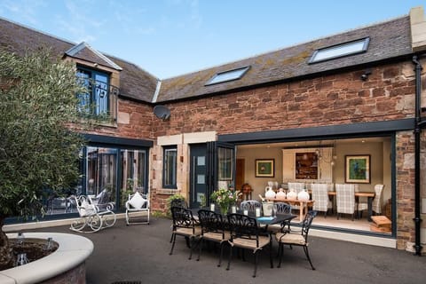 Coledale Stables - outside dining with garden furniture and seating for eight