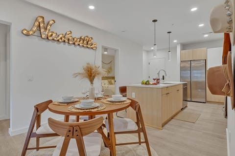 Dining table for 4 adjacent to the living area and kitchen.