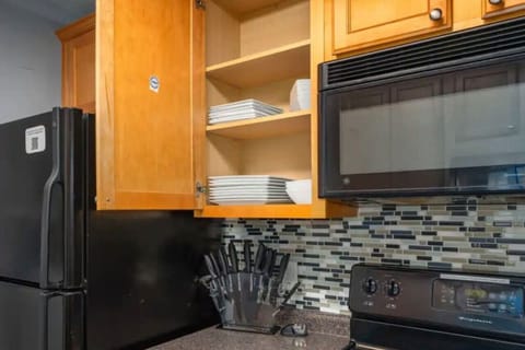 Well‑appointed kitchen stocked with everything you need — Keurig with coffee pods, drip options, double‑basin sink, dishwasher, fridge/freezer, oven, stove, microwave, toaster, and Instapot. Plus, laundry access!